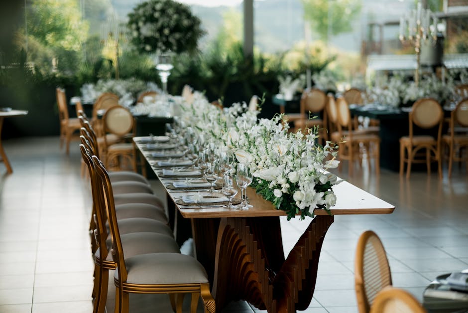 Elegant wedding reception table setting with floral arrangements